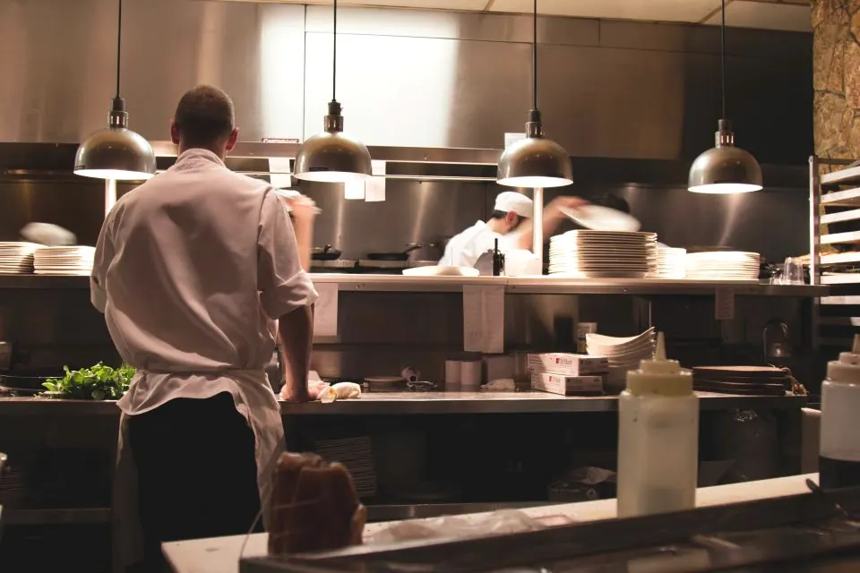 Chefs working in a restaurant kitchen.